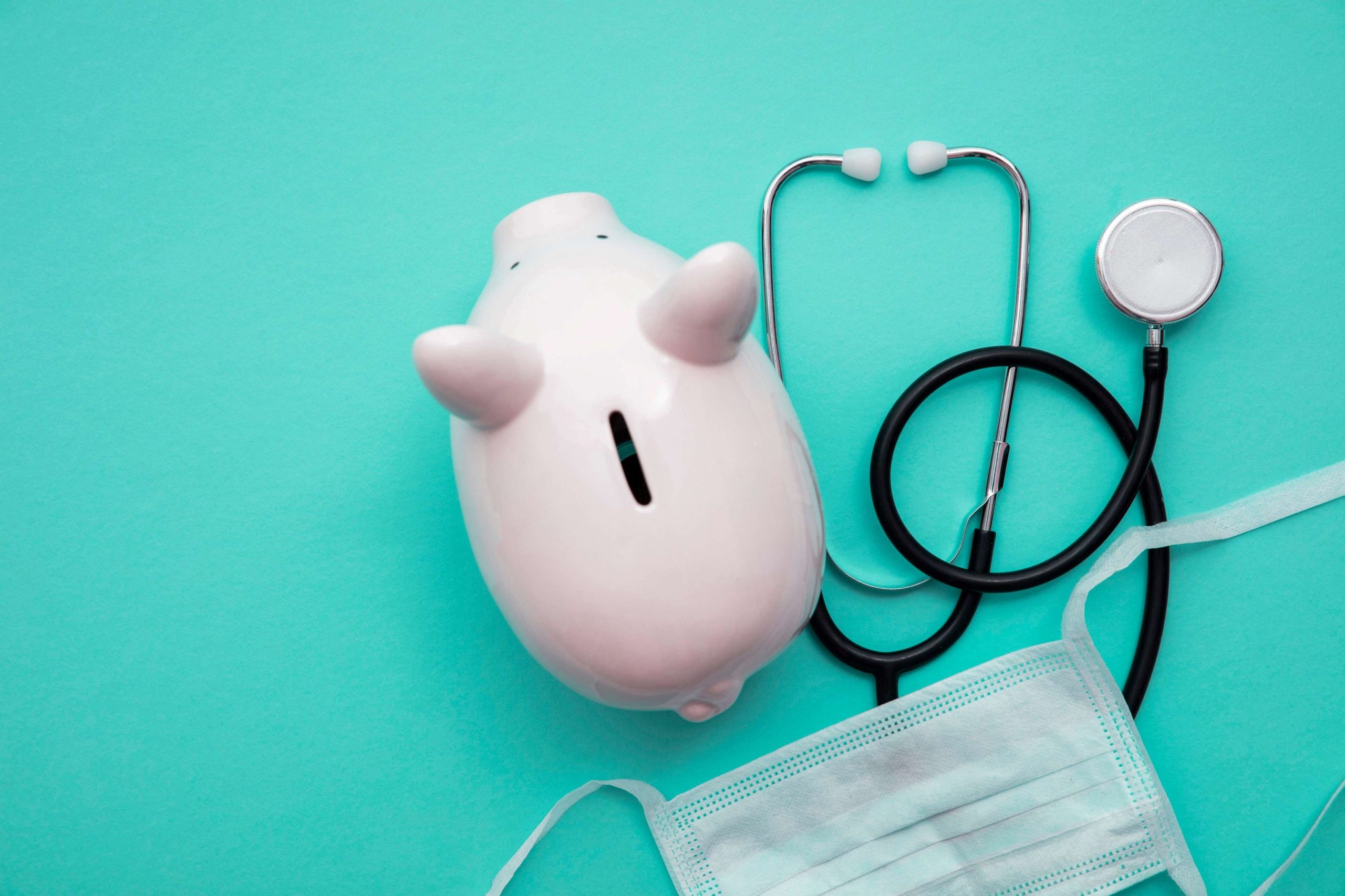 a piggy bank with a mask and stethoscope